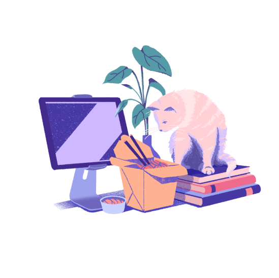Cat sitting on books next to computer