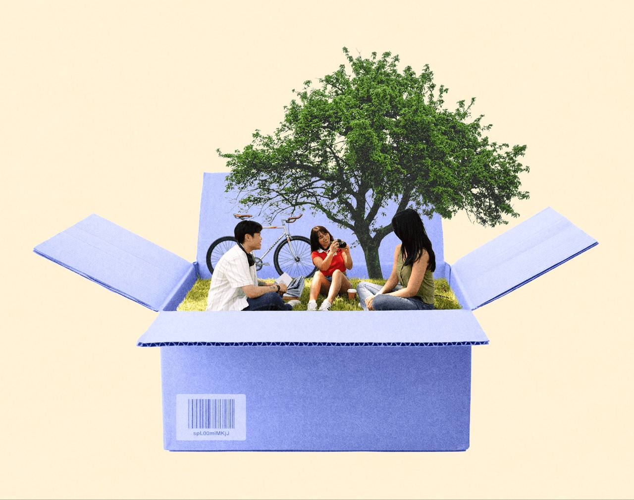 Friends picnicking inside an open cardboard box
